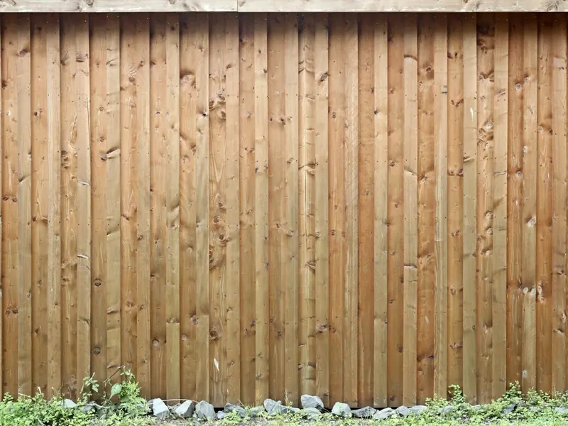 Timber paling fence with garden bed